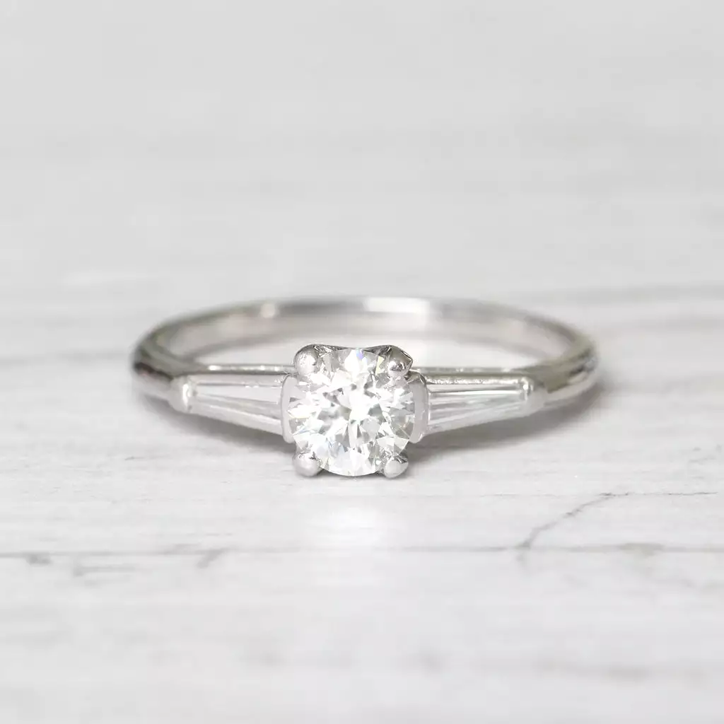 Vintage 0.65 Carat Brilliant Cut and Tapered Baguette Cut Diamond Solitaire